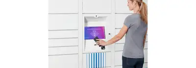student scanning a qr code on their phone to open up a smart locker